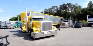 Professional driver jackknifing a 53 foot trailer into a parking space.