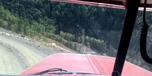 Peterbilt logger comes off a cliff.